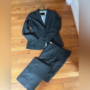 Banana Republic charcoal grey pant suit. Lined. Pants size 8. Jacket size 6.